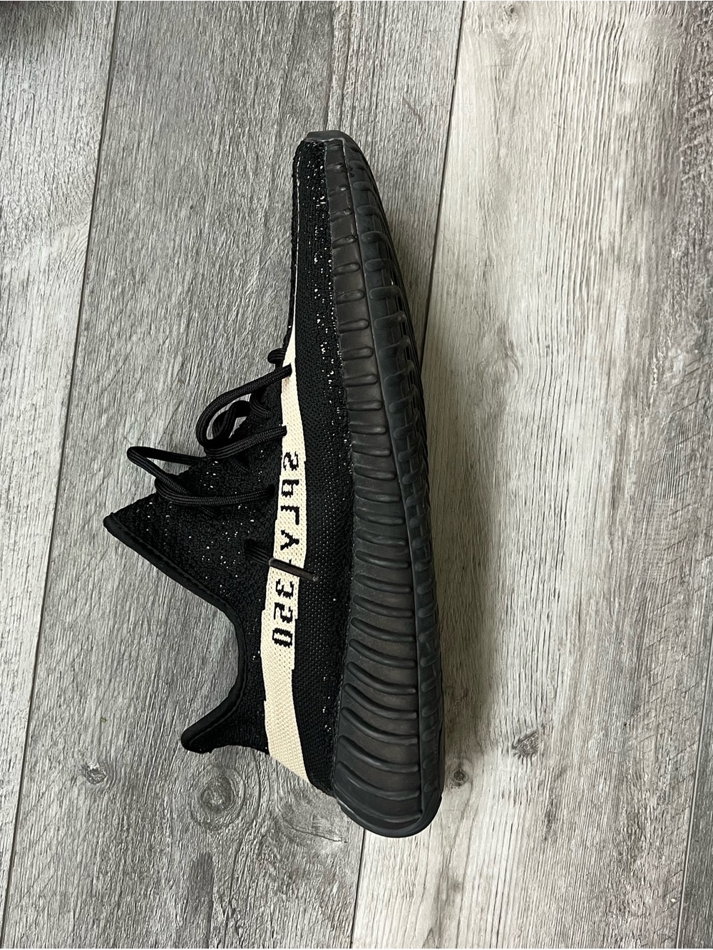 Yeezy Boost Black Knit Sneaker with Cream Side Stripe